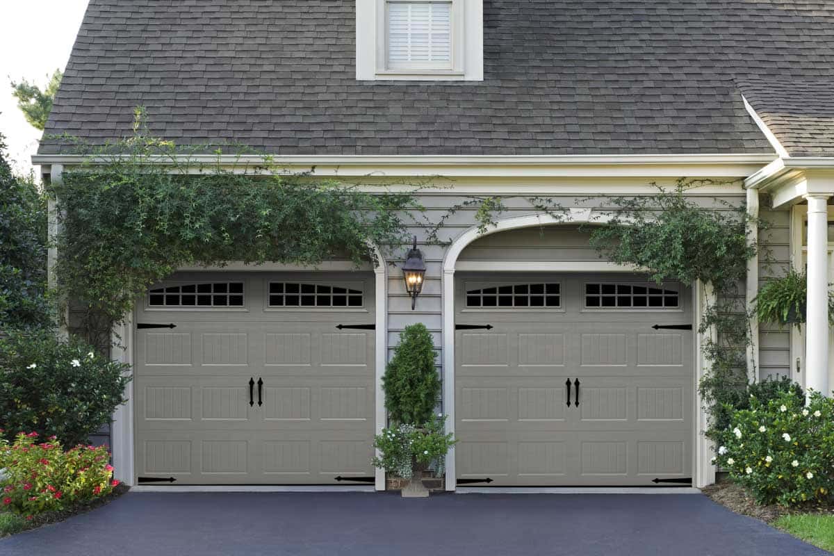 House with two gray, bead board design garage doors